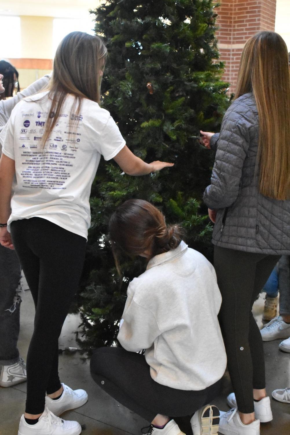 Student Council Decorates The School Christmas Tree