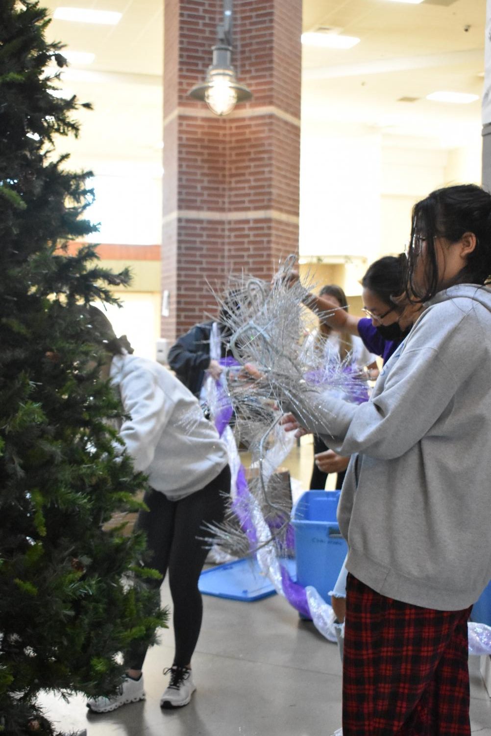 Student Council Decorates The School Christmas Tree