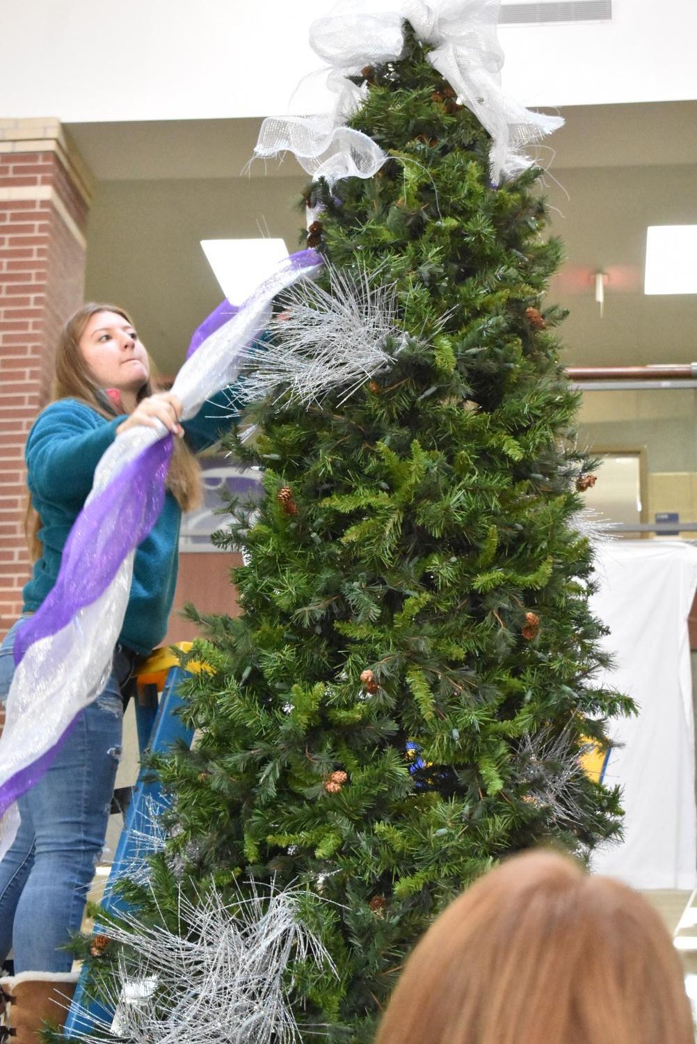Student Council Decorates The School Christmas Tree
