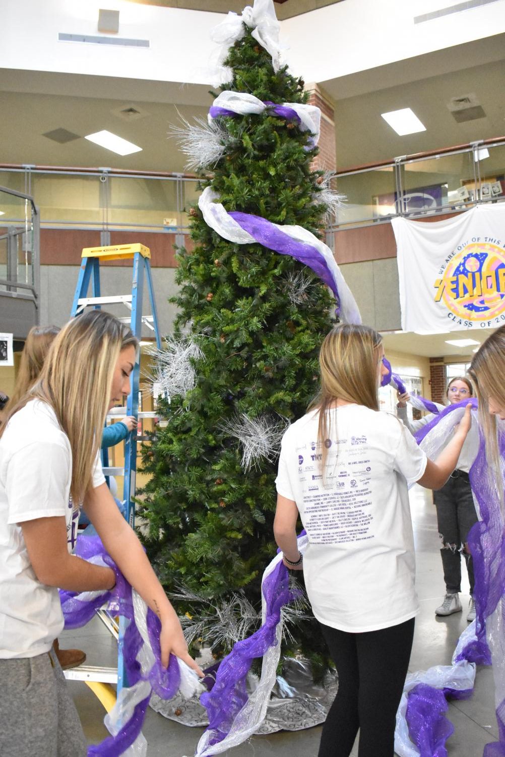 Student Council Decorates The School Christmas Tree