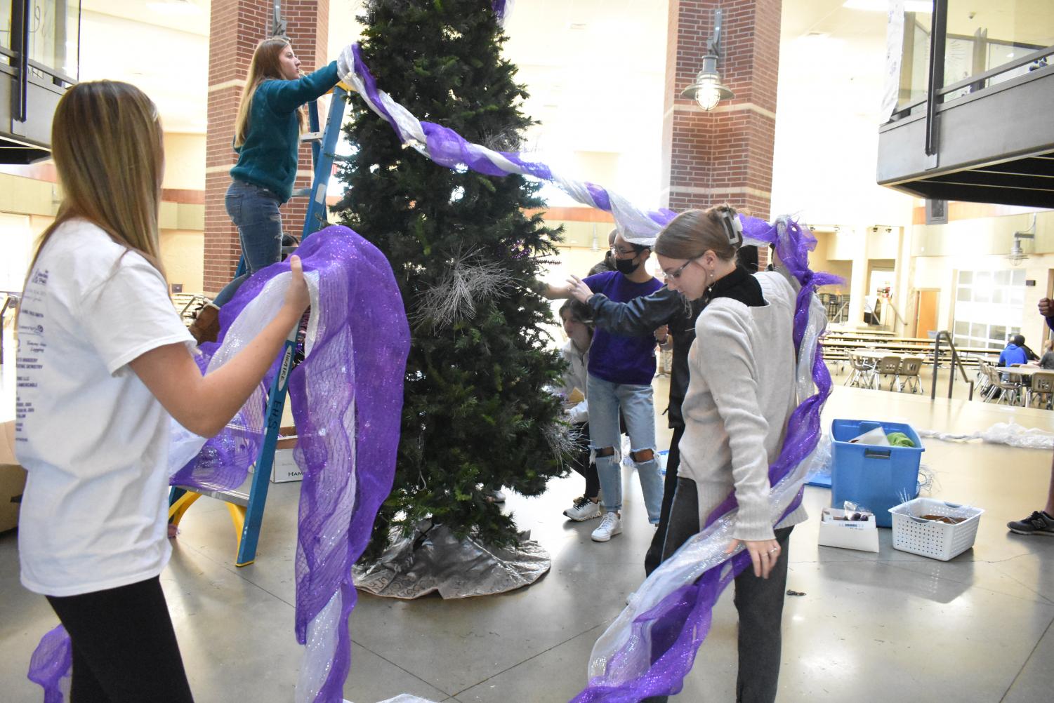 Student Council Decorates The School Christmas Tree