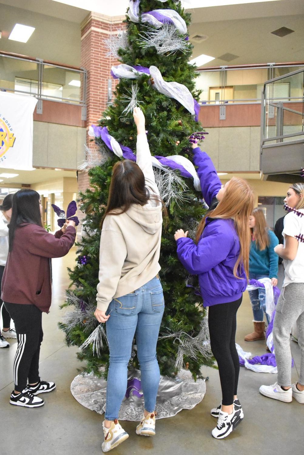Student Council Decorates The School Christmas Tree