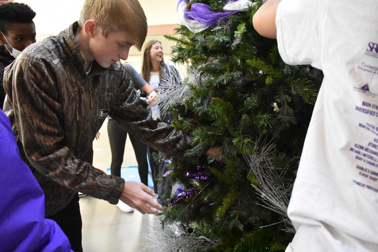 Student Council Decorates The School Christmas Tree