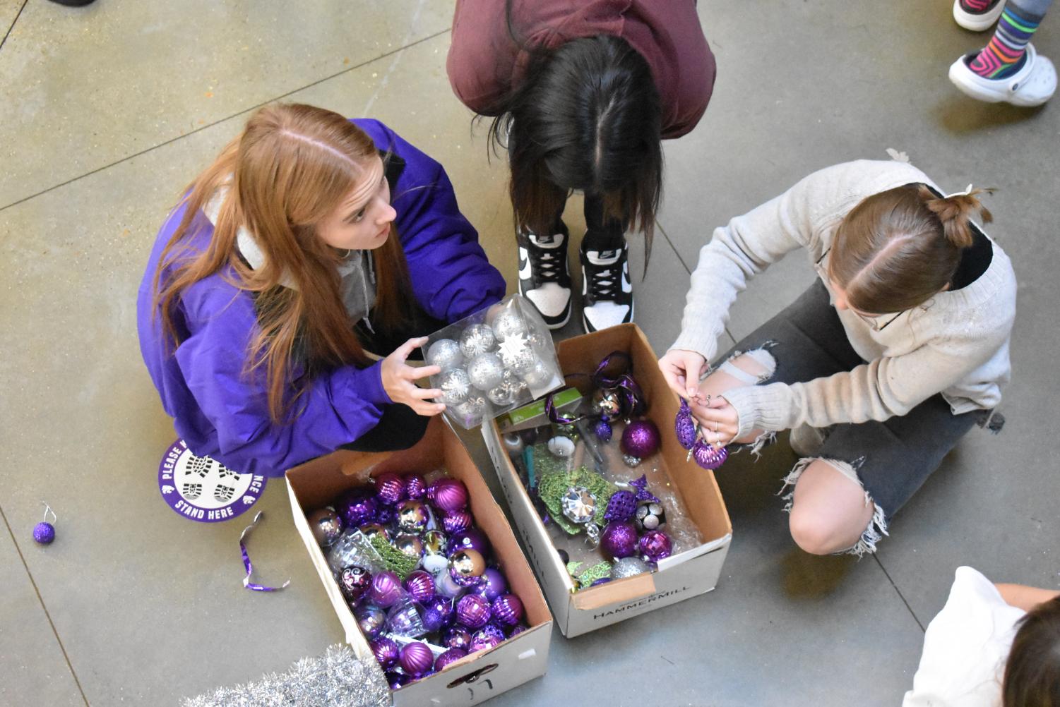 Student Council Decorates The School Christmas Tree