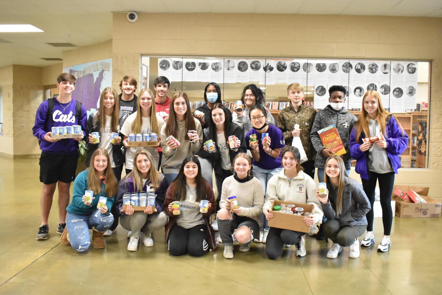Student Council Decorates The School Christmas Tree